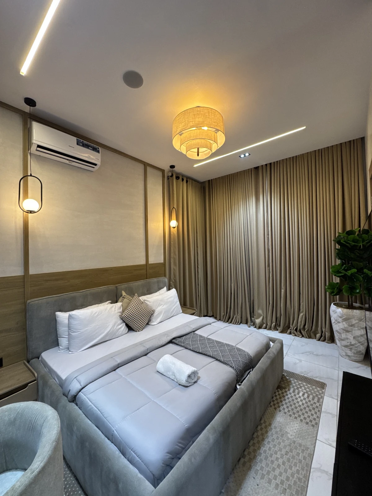 Veyra — bedroom with upholstered bed and warm lighting, view 185