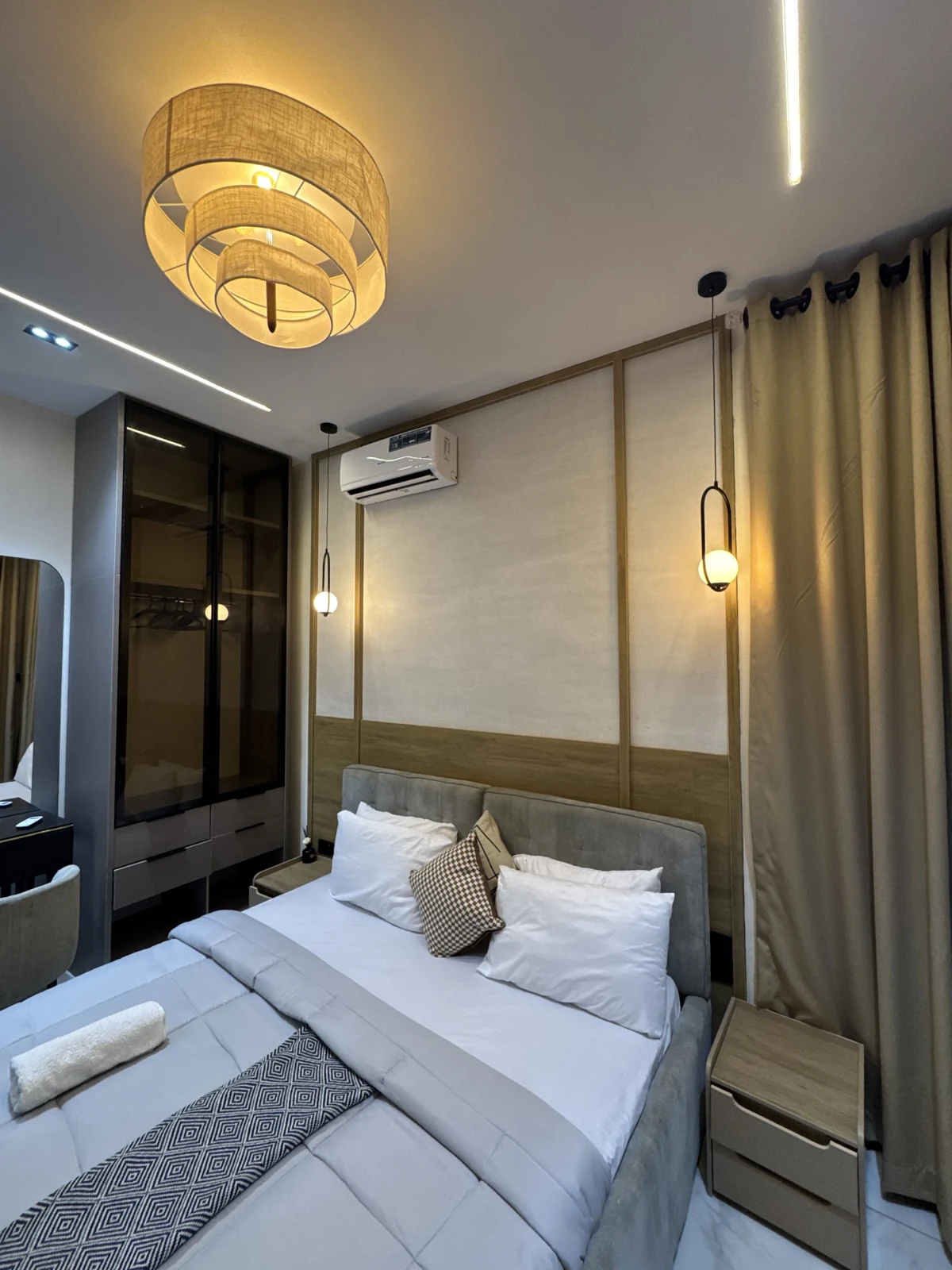 Veyra — bedroom with upholstered bed and warm lighting, view 186