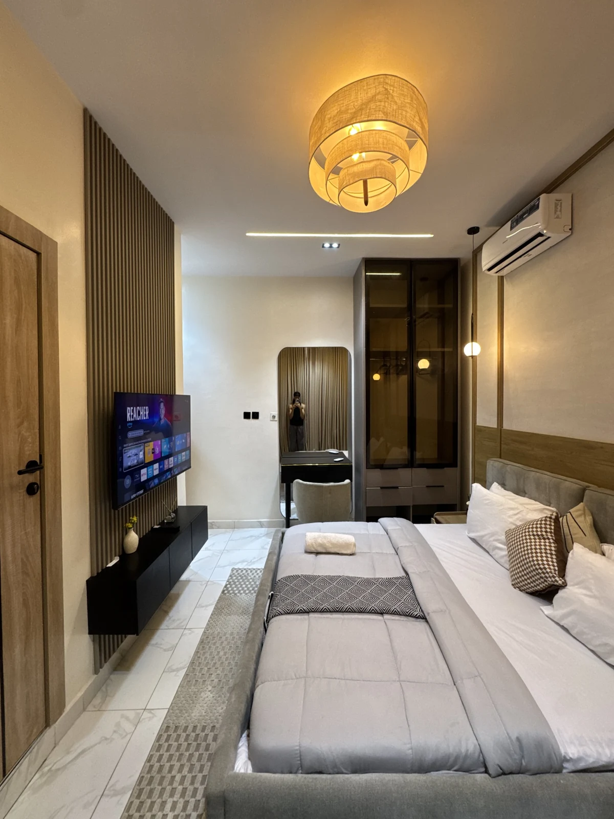 Veyra — bedroom with upholstered bed and warm lighting, view 187