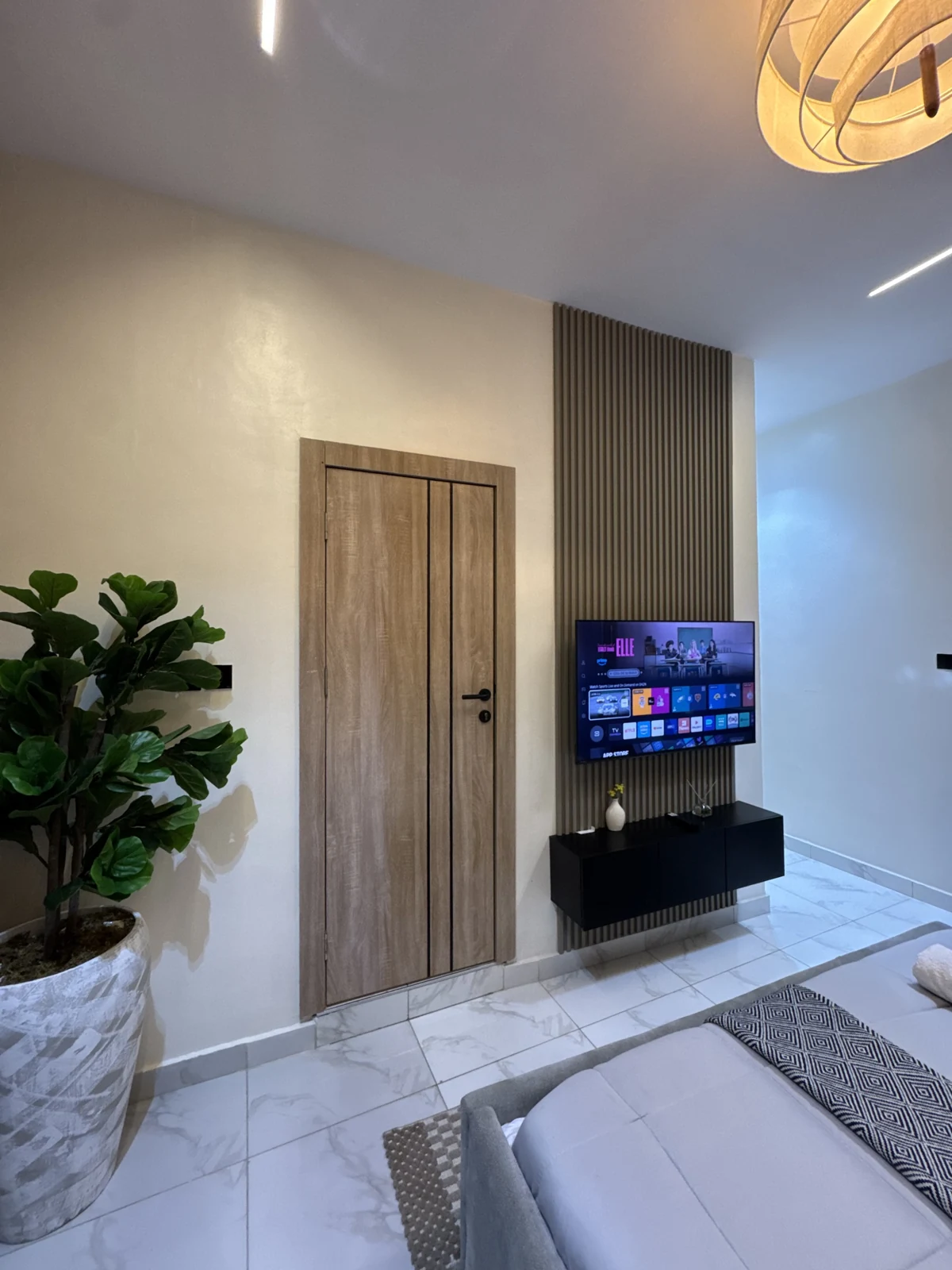 Veyra — bedroom with upholstered bed and warm lighting, view 188