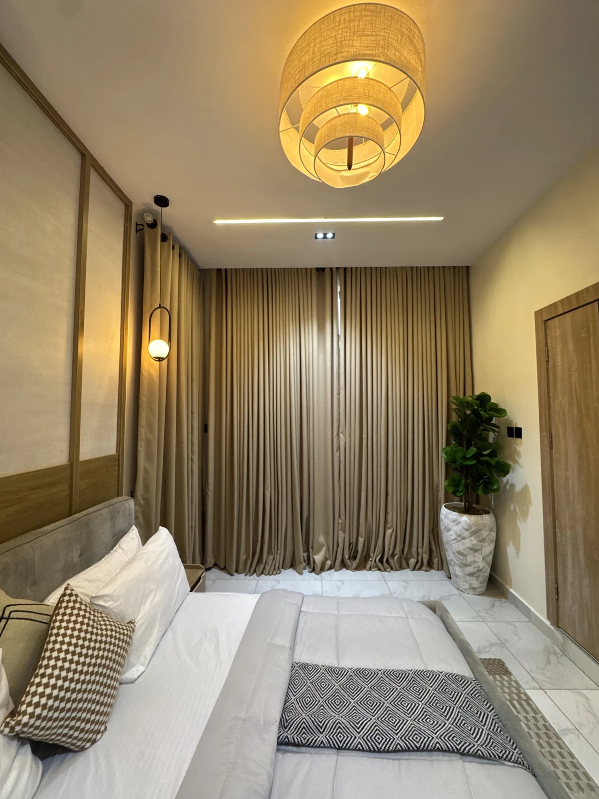 Veyra — bedroom with upholstered bed and warm lighting, view 189