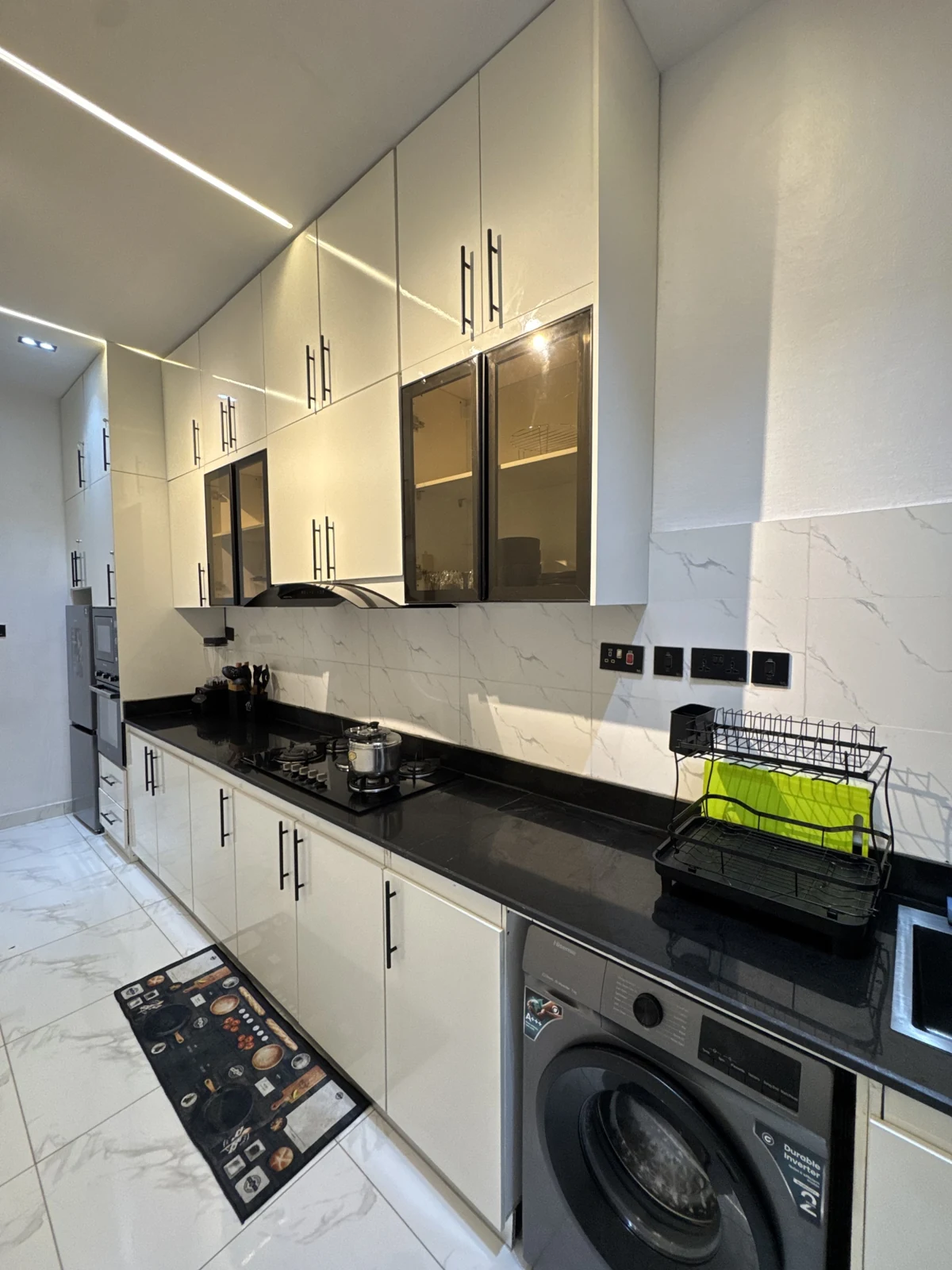 Veyra — fitted kitchen with white cabinets and black counters, view 194