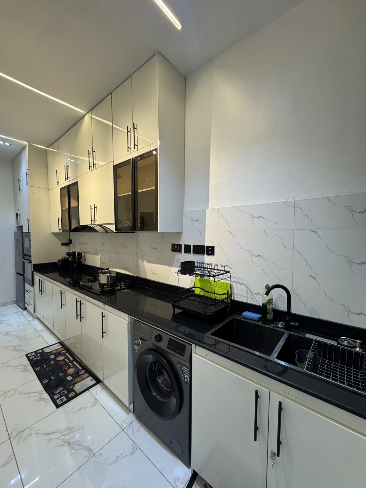 Veyra — fitted kitchen with white cabinets and black counters, view 195