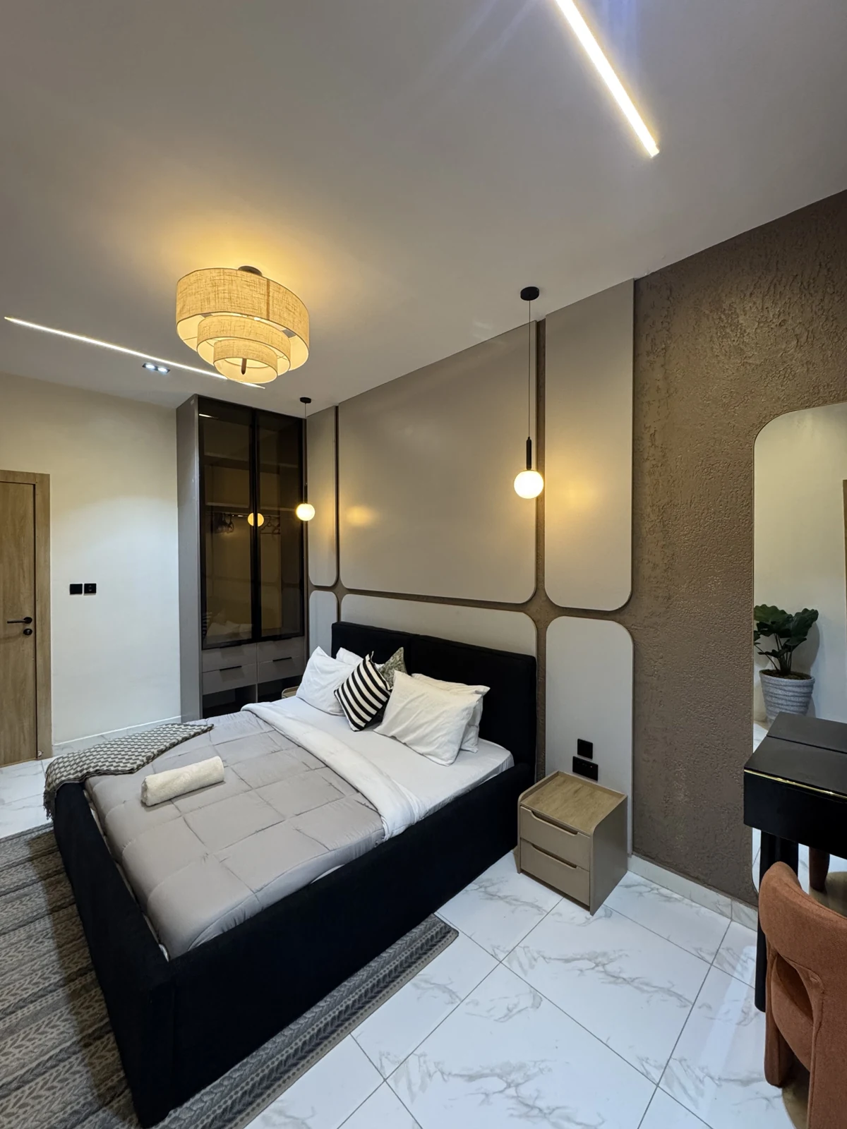 Veyra — bedroom with upholstered bed and warm lighting, view 201
