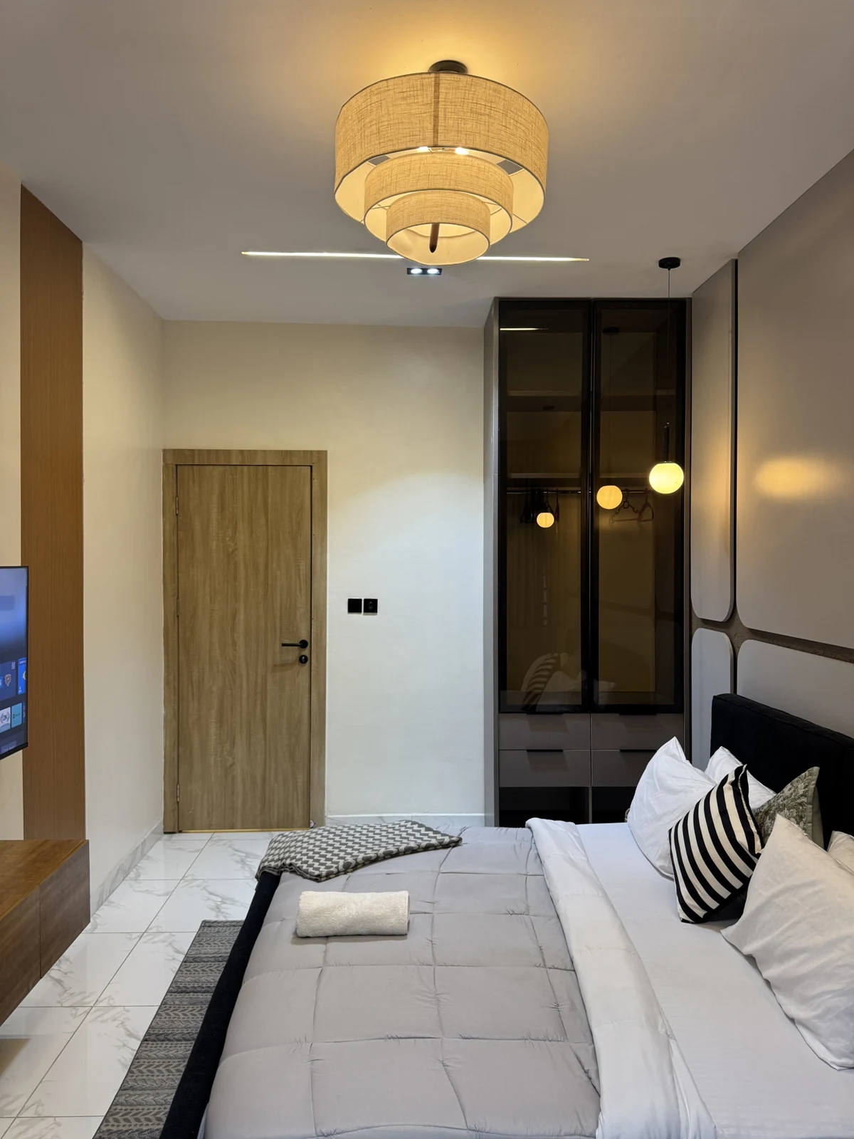 Veyra — bedroom with upholstered bed and warm lighting, view 203