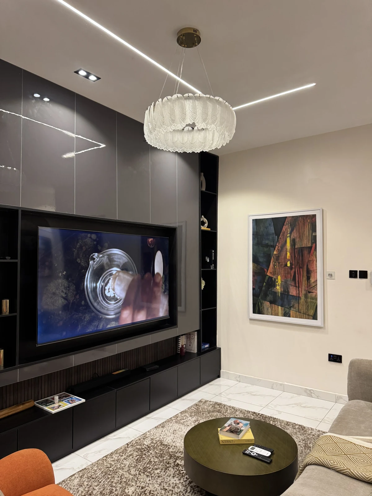Veyra — living room with curved sofa and orange armchair, view 207
