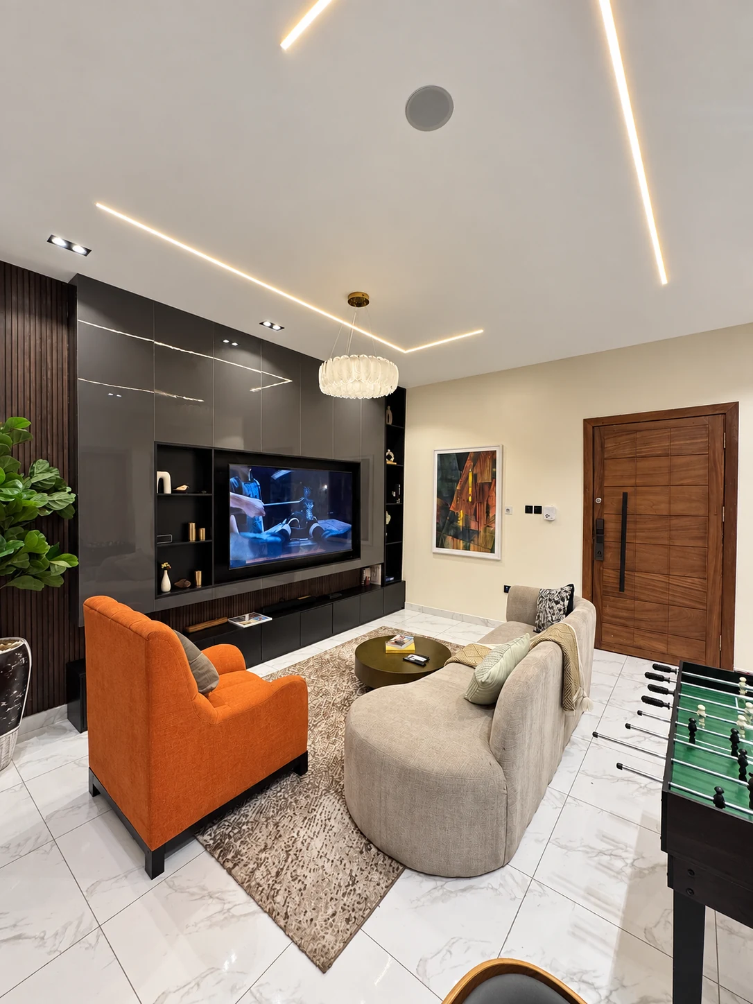 Veyra — living room with curved sofa and orange armchair, view 213