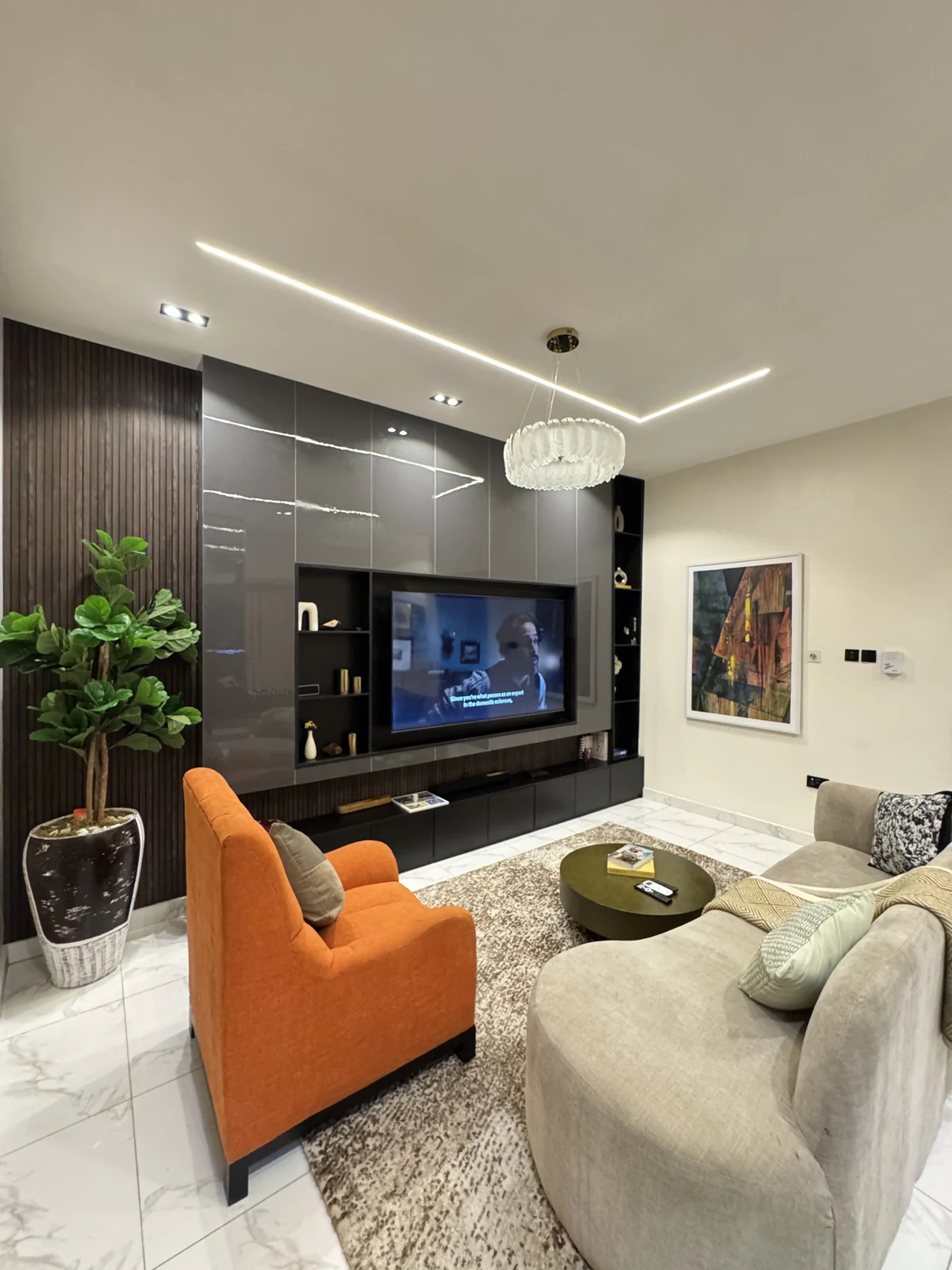 Veyra — living room with curved sofa and orange armchair, view 214