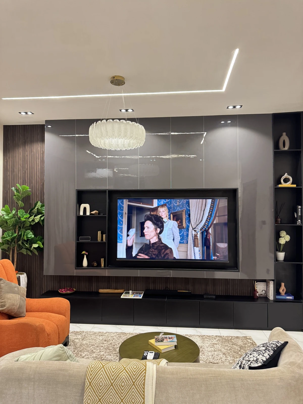 Veyra — living room with curved sofa and orange armchair, view 220